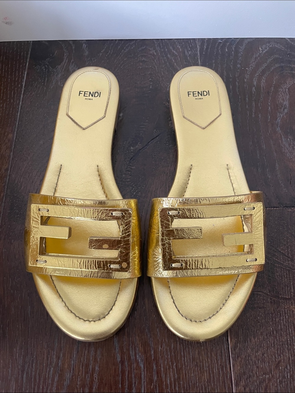 Fendi Baguette FF flat slide sandals in Metallic Gold size 38.5